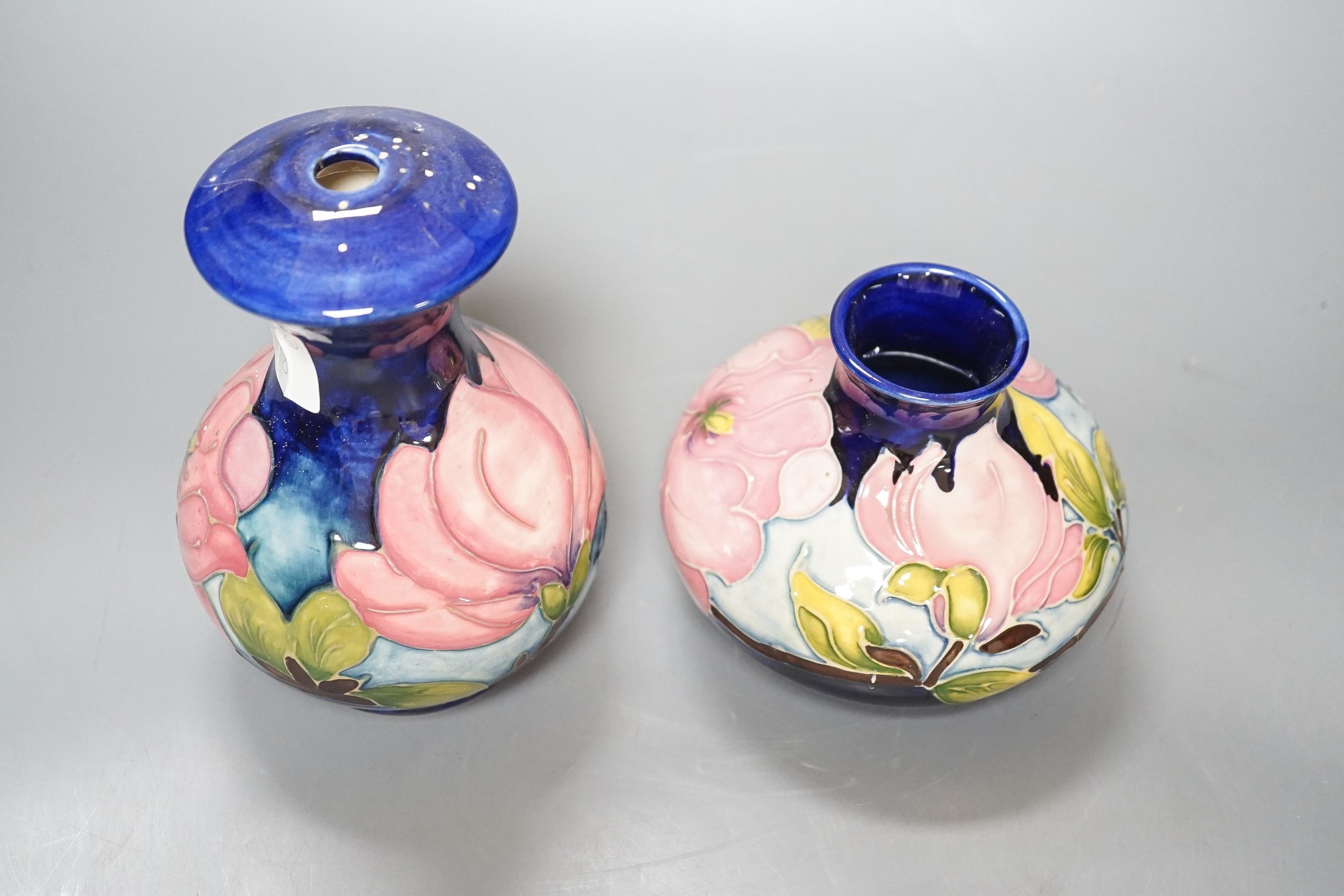Two Moorcroft magnolia pattern vases 17cm